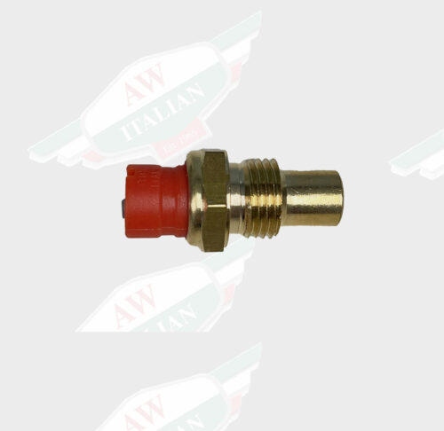 red gold switch laying on its side on white back ground