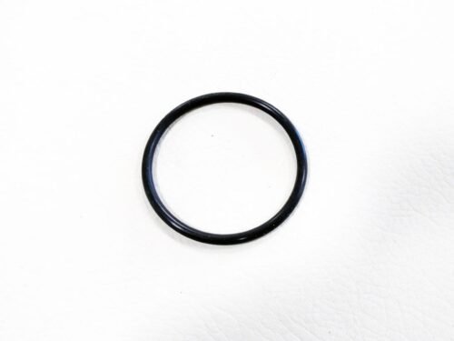 Black O shaped ring laying flat on white background