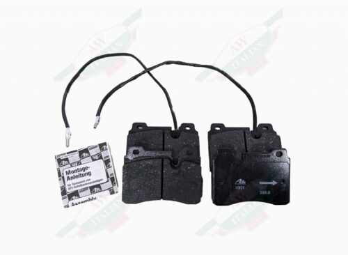 black square metal pads on white background with two wires extending from them