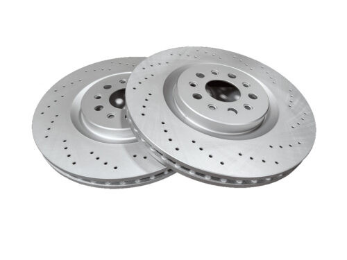 two grey metal discs with holes