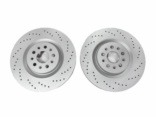 two grey metal discs with holes