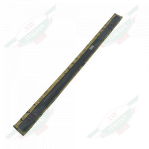 Bl;ack metal strip wrapped in plastic on yellow cardboard on white background