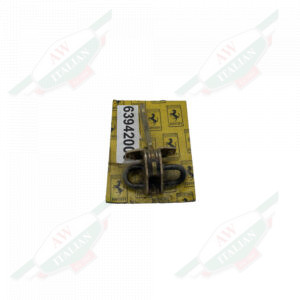 Gold metal wrapped in plastic on yellow cardboard on white background