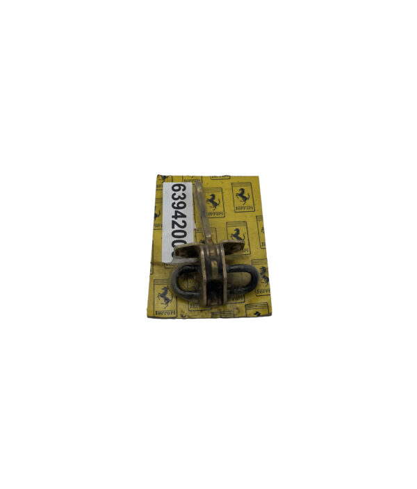 Gold metal wrapped in plastic on yellow cardboard on white background