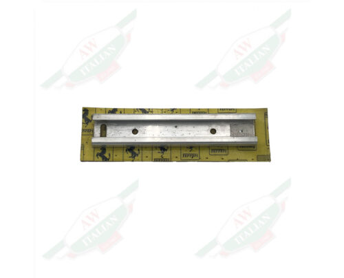 Silver metal bracket on yellow cardboard on white background