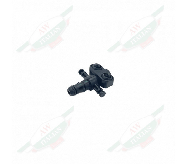 Black plastic cross shaped object on white background