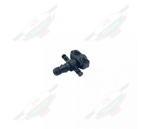 Black plastic cross shaped object on white background