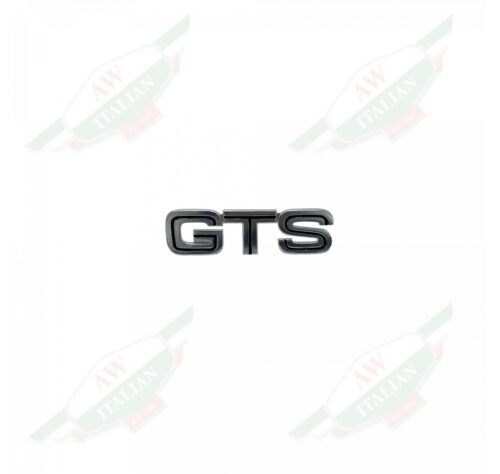 Silver lettered badge on white background