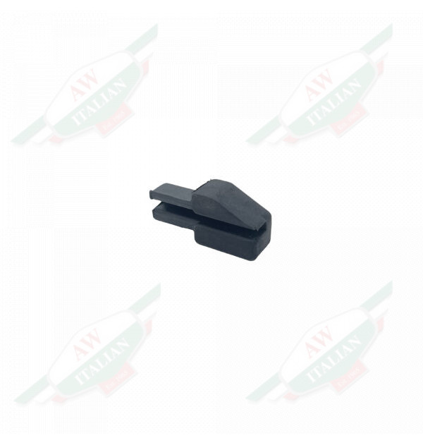 Black rubber arrowhead shaped object on white background
