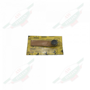 Tan leather strap encased in plastic on a yellow cardboard on white background