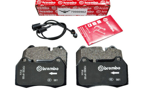 black brembo brake pads with red box and wires