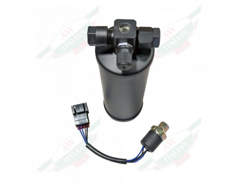 black metal cylinder with threaded fittings on top and sensor wire