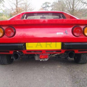 red ferrari with yellow license plate