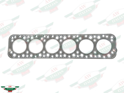 grey rectangular head gasket with 6 big holes