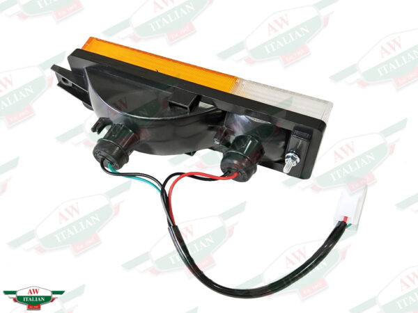 orange and clear rectangular light with black wire