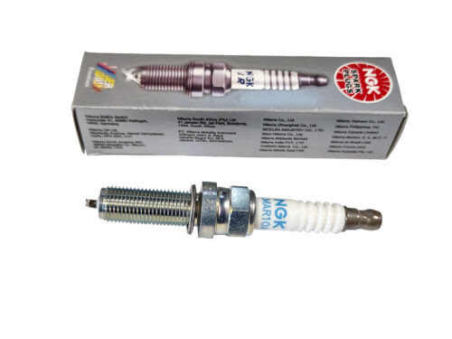 white and silver ngk spark plug with grey box