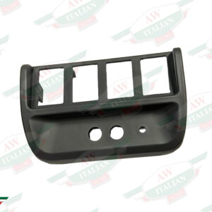 black plastic trim with 4 rectangular holes and 2 circular holes