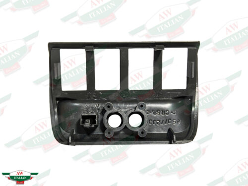 black plastic trim with 4 rectangular holes and 2 circular holes