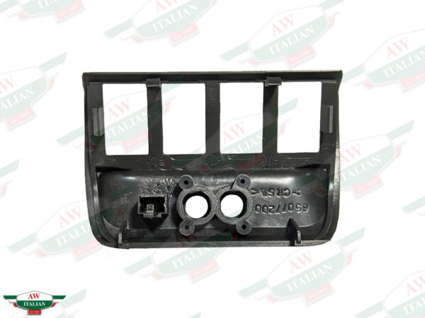 black plastic trim with 4 rectangular holes and 2 circular holes