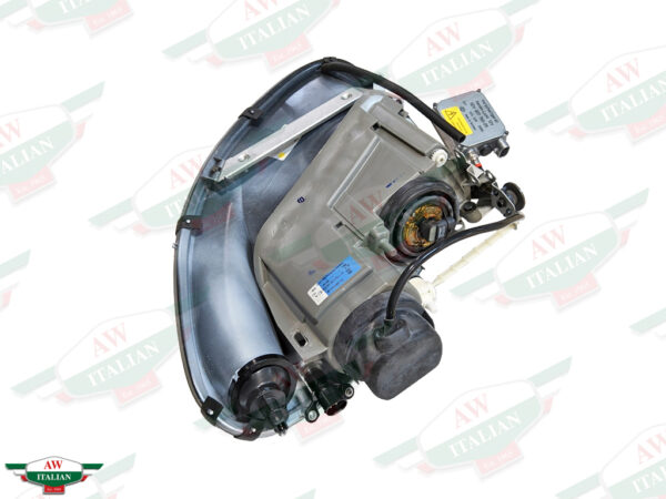 silver headlight with black wire