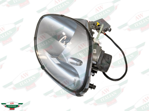 silver headlight with black wire