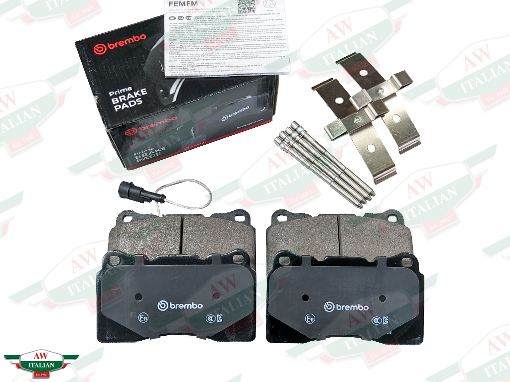 brake pads with wire and metal clips and black brembo box