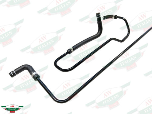 black bent thin metal tubes with hoses attached