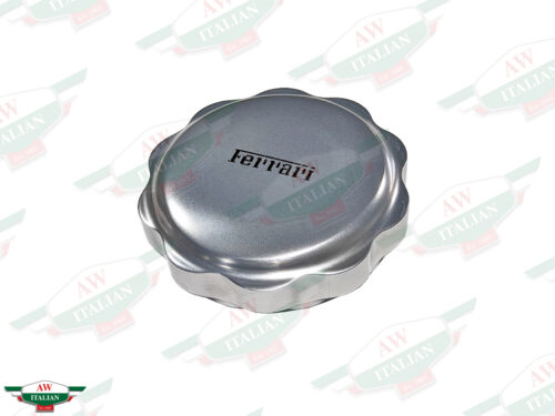 round grey metal cap with ferrari letters