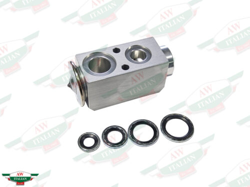 grey metal block with 4 circles