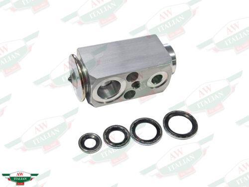 grey metal block with 4 circles