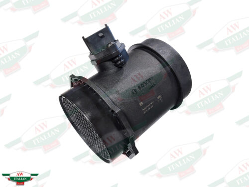 black plastic cylinder with wire plug in center