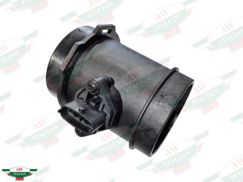 black plastic cylinder with wire plug in center