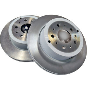 two grey metal discs on white background