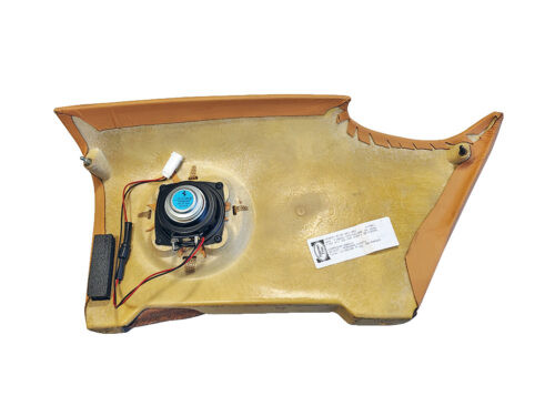 tan interior panel with speaker hole
