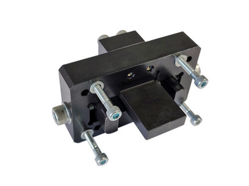 black rectangular tool with grey bolts