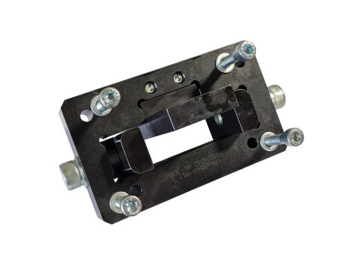 black rectangular tool with grey bolts