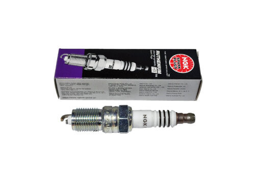 white and silver ngk spark plug with grey box